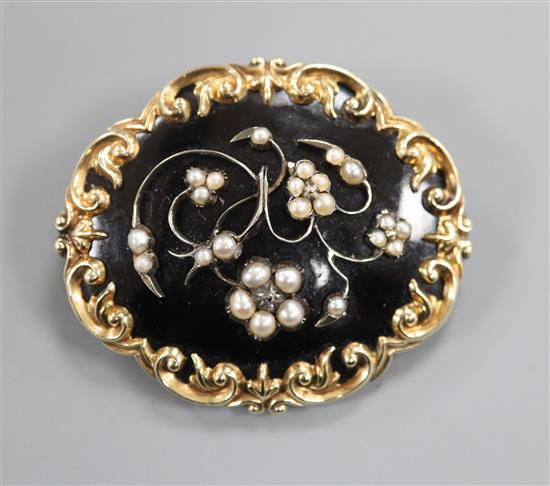 A 19th century yellow metal, black enamel and seed pearl set mourning brooch, in memory of Samuel & Alice Worthington, 46mm.